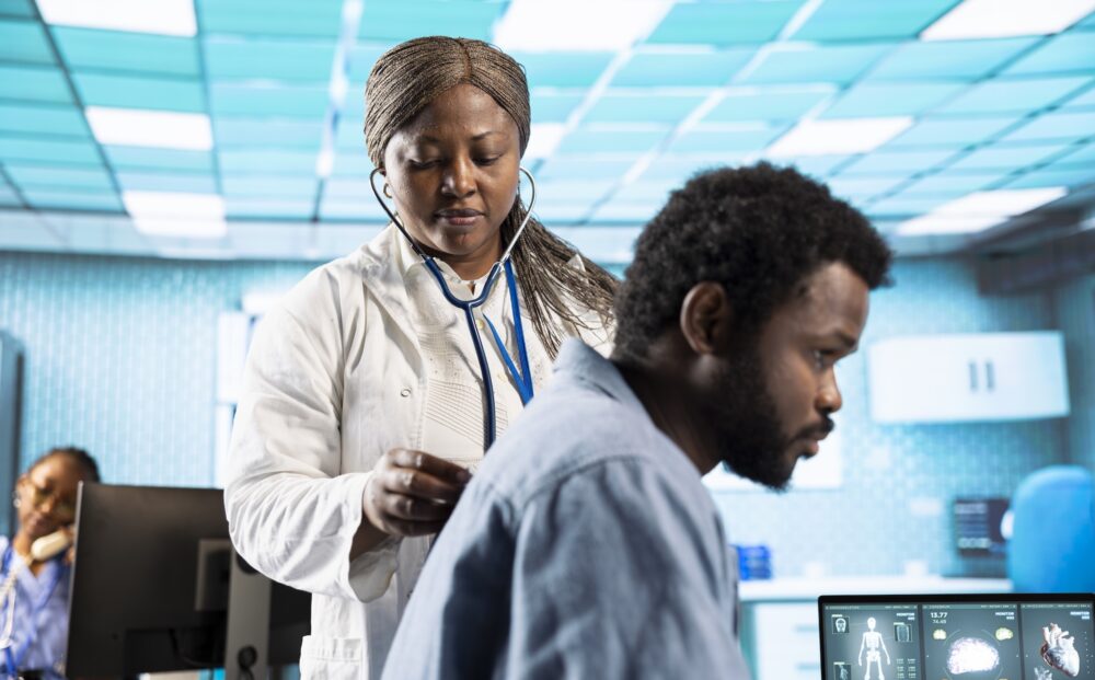 African american doctor does a respiratory examination checkup with stethoscope, listening to heartbeat and lungs functioning normally. Medic specialist checking pulse for young man. SSUCv3H4sIAAAAAAAACqRXwY6kNhC9R8o/tDiPIxsMmNxG2RxySLLalaJIqwgZY3c7AzbCZrKt1f57CpjuoW1WPdJeWrh4PJerXpWrv/z4w+GQNNxpkfx8+DKvYK27bnJ+5F5bA2b88GIfpWnluLU8j1mBtwautyvZam9HzbutseFenAzvJRjN1HWz+evyMnGe+8lJN/vyYhLcyyNwrMYrxerwp3V9uLxYXsIX8Cr59UOKU4qrtECPhnvbn+s/xyM3rv4o5t9H09Z/1x/42SGMGcl/+nc4Jg8bHjc1M09yMa0O3d/tdzi14F39C2+0kb7+6339UfrXTR422HdWQIDqP6bRycWj9xB0aXz9m6kf63eaH4112tUfrO2BIcXfz0C/myG7H6r14Z+rKo7SiPOS1U22R9lJvmb7JZEJZZnKJeOo4JghqhRHVaMEIoSmKmeMNqy97JzQpq1UluYopWWLKKAR4/AtKVRaEYXzpmyu4IwKrGRGUVG2GaJMlahSKfxQyrCUlLcSX8E8qyqMOUMFbTCiVUsRI6REnLGKZCpjWfkKLiQrMW8a1HJwl+KWoKZRBWqkoqIkbSraaonMGo7k6T8vx34r50c1gmLMAWpiedgqOylImhVJENBFYwGsqLIQ1q9SPEBdKRXA8yKCt4sSIlz+DdpbIM7TiHA4naFQdXSiHU5hjZs6f+k5r+iSEBahh1WiAW0W0yrZ807e4KoiL6sQ5wYJfnbaBZyYplHwrVJa3HIWuCAxp5f+ZJ2wQwAm4GkU0yBI4GVOQtDZTuZ4y1WmOQthZi7lMOQMh7DRTh46VHAQTGmUm5MUT9NwPy28fdZOhy7iDJffSPebsCfJO386CD7K+5ID8OgbuXTlV2iaY1ZG5xqlGzRcc3Y836Dn8k4jjzttgporGdkpIu55qKE4k/Iz77V5q9qnLsgnwyTW8Bqn270hoNnOsSH0LnAyzaPAt2vv91q4+06OcrBjwEowzeIU+RHS00flu5fNFw/0G/b3EqYK29njOaQlUS7nOpcmEh8pYu3Lz4McvQ7raa8vLG0xLihaxs0uljKmUT47KPbg4FmekjKKEje8g0YbZJQwHHUGYft+AhnHwgMBsEgAzZypUxSnIqXFTo+IemfFyP6NENwdu/nUBkbQaUcmJI/vGSOn3hp9W3gkoxCv/TPJ+ye6dIcoUntgbZQd+xhMMIFZ4oLeDD98arXdzADPFqIyZzDbgvTAR77OCi+mASaENSEXi4XTzJf2hUnAJeGXjpYQ6HlXNVk78Ga5CxXsJK9dgzsHX7QX+2Z7Af8CbL/Zyli/jGvJyjr3uplvjjRmOVxYcGkxUBJIdDvQn6Dc1h57IYK1eNLt9mB69iBpRc7LsmColbRBNJMNYhiWEqqYl7ShMDtANL/+DwAA//8DAPDGtv25DAAA
