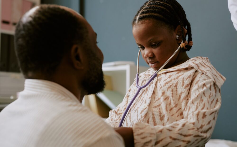 Young girl wearing a sweater while using a stethoscope engaging in a role-playing scenario with an adult figure in a domestic setting SSUCv3H4sIAAAAAAAACpRUy47cIBC8R8o/jDjHCm/s/YJcVso9ygFDe42WMZbBG0Wr/ffg5zAT5ZDLaKguqh90+f3zp8sFtTo6g54u78spn533c0yTTi4MGcZfdnyCwcJUIm8Tk7gEtCtPYF0Kk9O+BFudTD/oK2RwmL1f4I81iGLSaY4Qi1rsBPoak1vp5Ezj9fV3CRDKpi4D7GTY0EJMwbyWNAtjiC6NfUghloFuAhjda6kQ+zklmE6Nok6jE7zkxu4qPab4YztfjsAazDdyCH0D7VNv9ARfn/NwTJ7Mnm5LObcL69lFA97rAcIc0RHfcv9D+DuE0cN/iG1/fp7jeoHBLBN9/yj6nMCD3t5j7wp1HW0YY7QCRVjFqWJVyySrOgtEcdVIrPRRBgJjucG2qaxo6op3ray00KqishZtx2RNjDzJAqTQUJsKaysqLpWtWmJ1RRveAmG4xsDW+rei0euv/DrX9QX2cvVsXShe5C3kAS8EVvSk3agnfXdvnJxxw0uBhNSvi34omTAPaVrmg4gSZ8k+hFG3ee5Ply5nggPvdYz5hj3wcnWys8K1SDWEtA4YbarI5t1a8zCmCCU1VpJQzhvVoNIkvcs6a0VHjfPog7awJD0X5ME+ikpFBRXHjpdO2mPqsERhqj0mKS/u3flrJUjC5Y3wl9VWjpKsvnFurlujDN+lfzSgyhROJaMb4/DDsuhXl5n3nT9qMy6PT9Bja4yJZl2R3Rfn1ygndrb0+E0UEc6wyD+kPtfhEEV6GHQeuveRctxg3JBtc3dht1SKGqYEiKbJTmptxVlrqlaQfASFAZsGCwX51scfAAAA//8DACKHrXmkBQAA